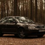 photo of audi parked on dirt road