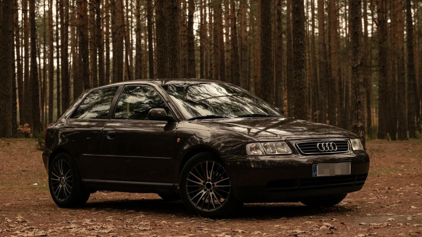 photo of audi parked on dirt road