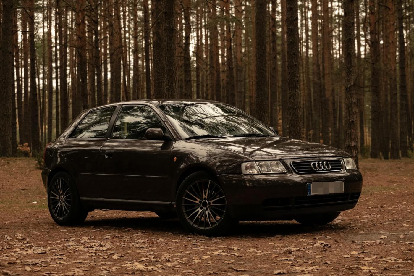 photo of audi parked on dirt road